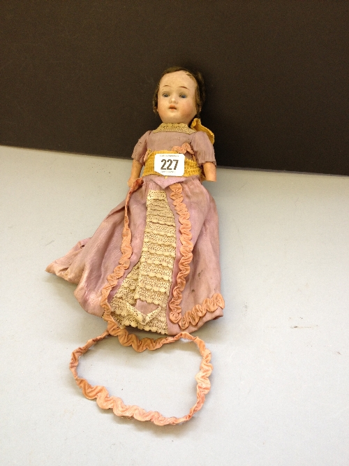 An early 20th century bisque head china doll by Walther and Sohn on composition body in original
