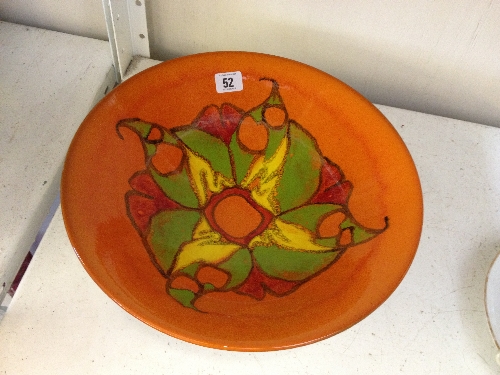 A large Poole Pottery Delphis bowl, shape 58, decorated in an abstract pattern on orange ground by