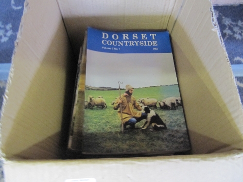 A box of Dorset related magazines.