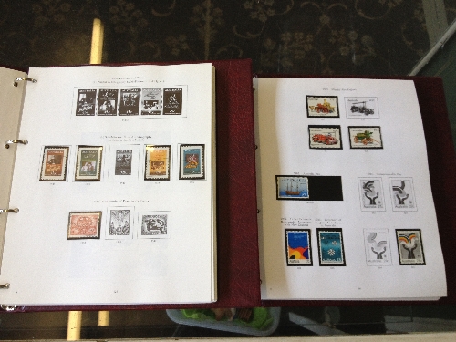 Two Stanley Gibbons stamp albums containing Australian stamps 1913 - 1990.