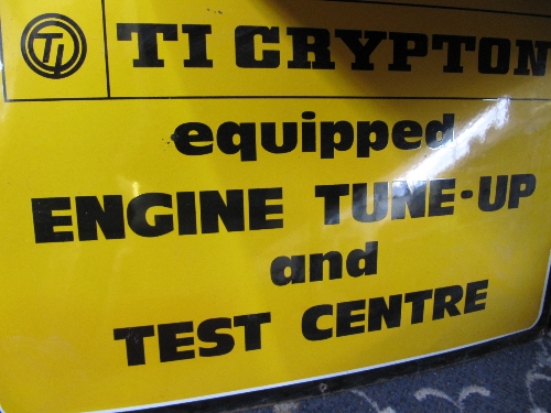 A garage metal Crypton engine tune up advertising sign.