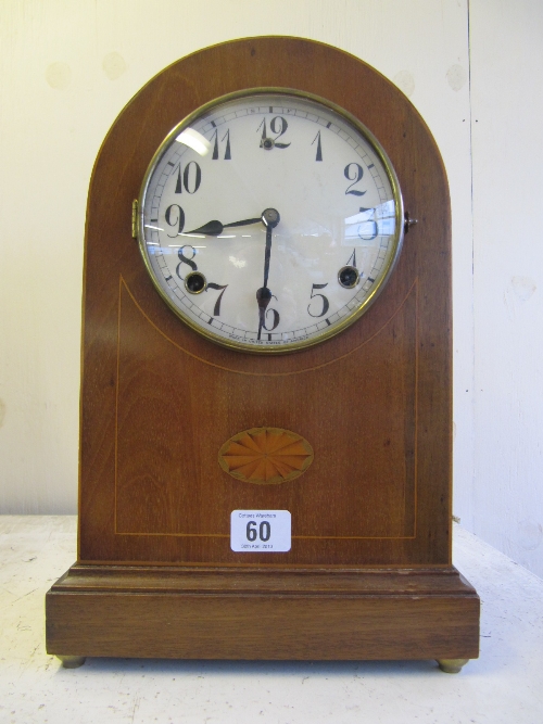 An early 20th century dome topped inlaid mahogany mantle clock.