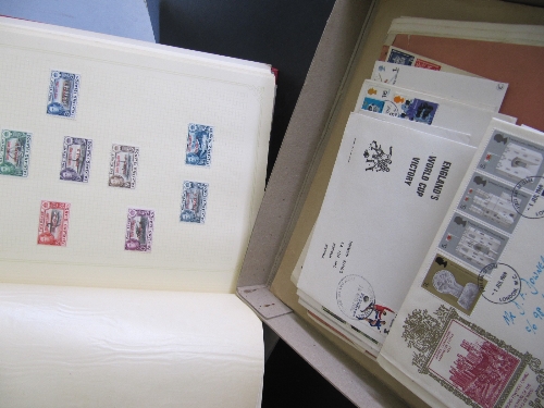 A red stamp album and contents together with various First Day Covers.