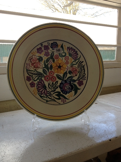 A white bodied Poole Pottery charger decorated in the CS pattern by Gwen Haskins.