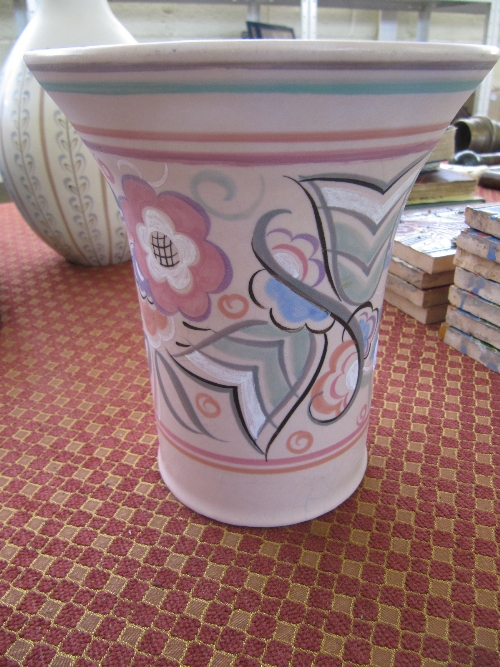 A Poole Pottery flared vase, shape 335, decorated in the CP pattern in tones of pink (restored).