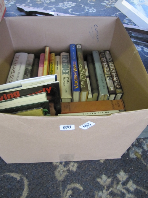 A box containing a large quantity of military related books.