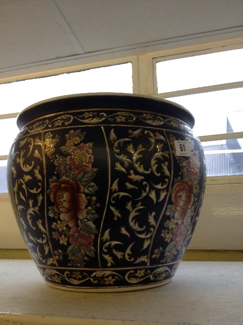 A modern Chinese style jardiniere with floral decoration.