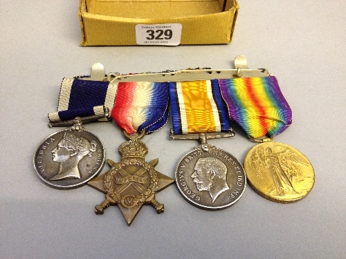 A group of four WWI Service medals including the Long Service and Good Conduct medal awarded to