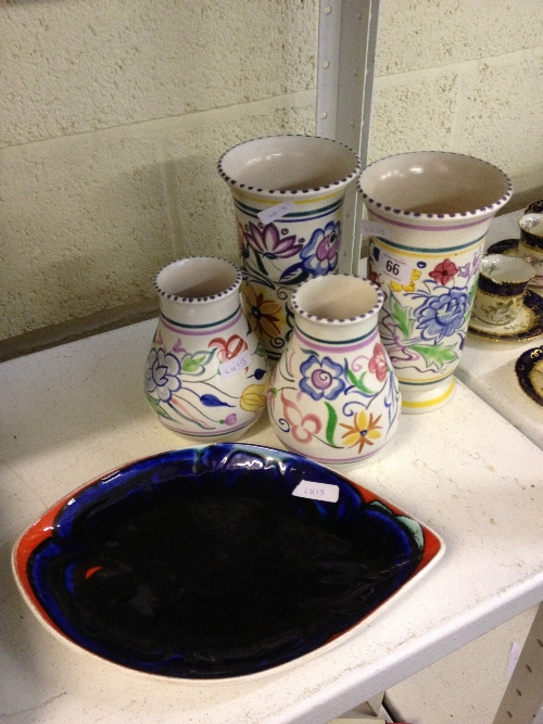 A pair of white bodied Poole Pottery vases decorated in the BN pattern together with a smaller