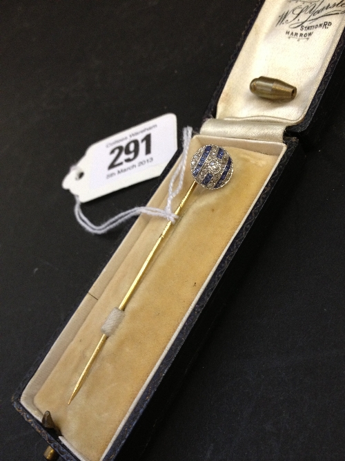 A gold Art Deco sapphire and diamond set stick pin in original leather case.