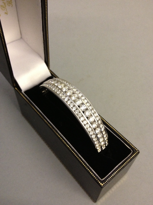 An 18 carat white gold three row diamond bracelet.