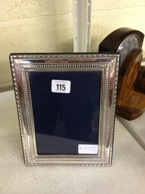 A modern silver photograph frame.