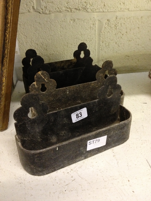 A set of four iron church pew ends.