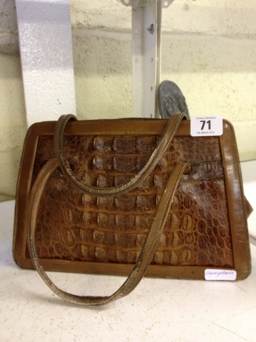 A mid 20th century ladies` crocodile leather handbag.