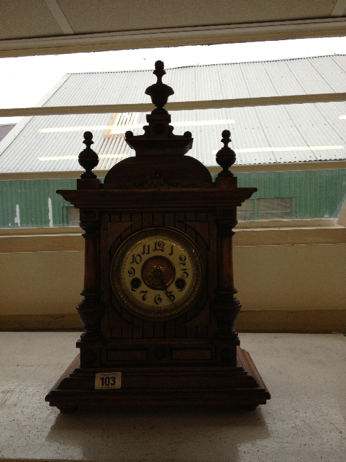 An early 20th century oak cased mantle clock.