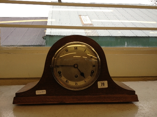 An oak cased early 20th century chiming mantle clock with silver dial inscribed The Northern