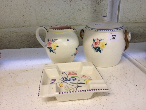 A Poole Pottery white bodied biscuit barrel decorated in the BF floral pattern together with a