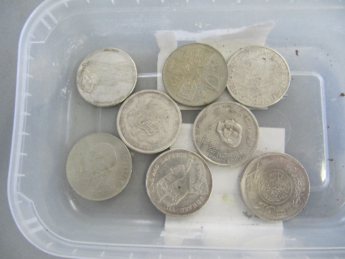 Eight various silver and other coins.