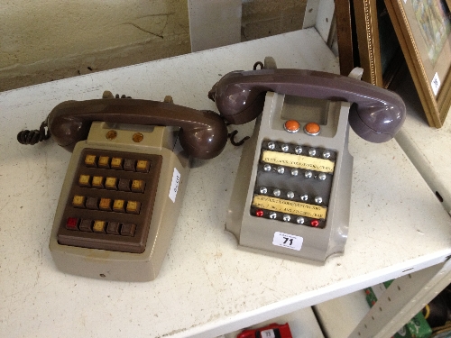 Two mid 20th century internal telephone handsets.