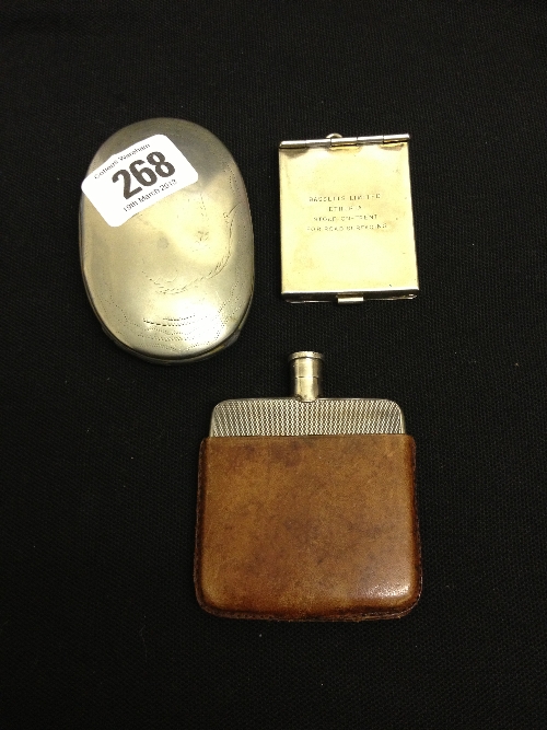 A small silver hip flask with engine turned decoration in original leather case together with a