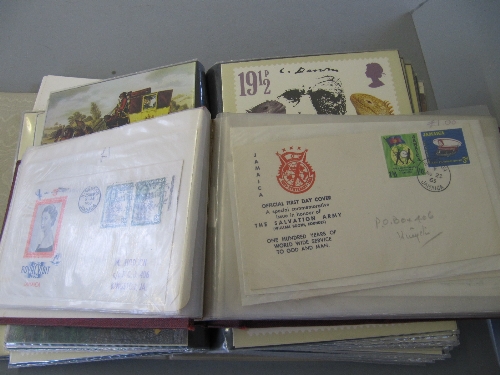 A quantity of various First Day Covers together with an album of stamp postcards.