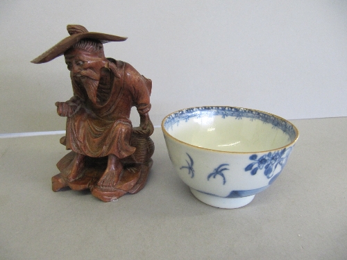 A small 19th century Chinese blue & white porcelain tea bowl together with a small carved hardwood