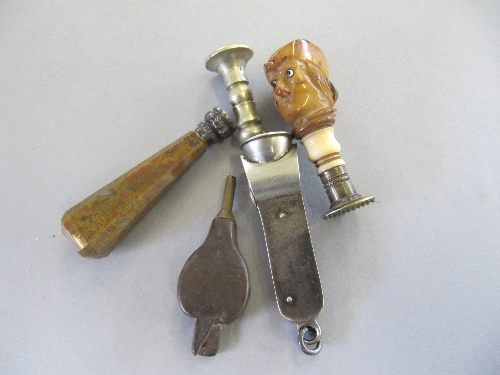 A silver cigar cutter together with a novelty 19th century brass and ivory seal with carved nut male