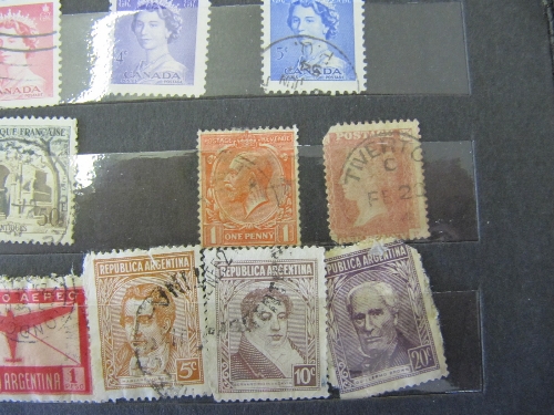 A stamp album and contents together with a quantity of loose stamps.