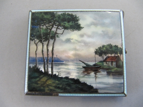 An Art Deco Austrian silver and enamel cigarette case the lid decorated with a lakeside moon- lit