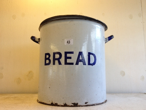 A large circular early 20th century white enamel bread bin (examine).