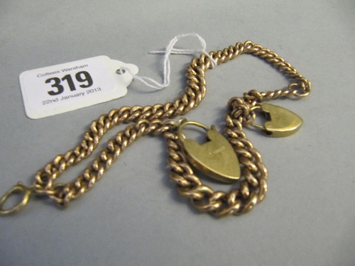 A heavy 9 carat gold chain with two locks attached (46 grams).
