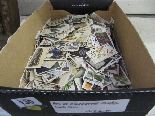 A box of unsorted cigarette cards.