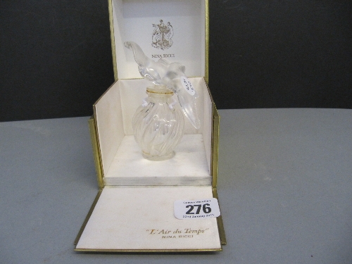 A late 20th century Lalique glass `L`Air du Temps` scent bottle in original Nina Ricci yellow box.