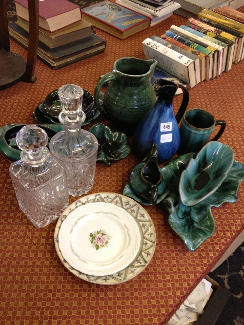 A collection of various Blue Mountain green glaze china together with two glass decanters and two