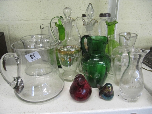 A good collection of various early 20th century glass jugs, decanters and vases together with two
