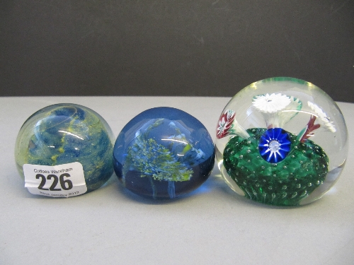 A small Mdina glass paperweight together with two others (not Mdina).