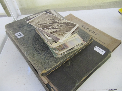 Two early 20th century postcard albums and contents together with a quantity of various unsorted
