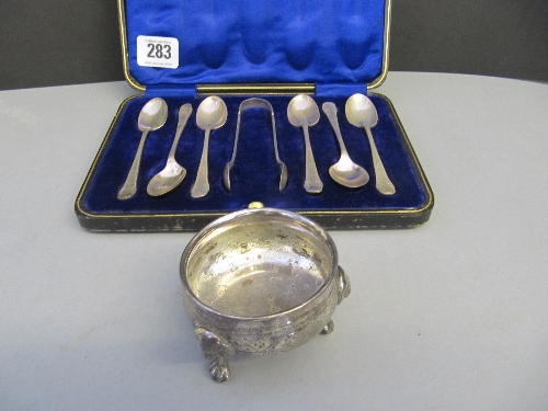 A cased set of six silver teaspoons and sugar tongs together with a silver plated salt.