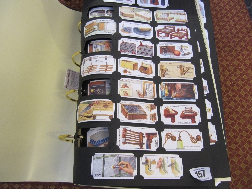 A folder containing a quantity of reproduced cigarette card sets.