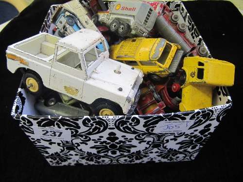 A box containing a collection of playworn diecast Lesney, Dinky and other vehicles.