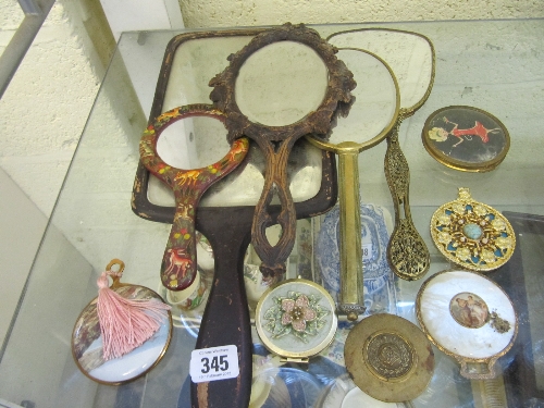 Various dressing table mirrors, hand mirrors and compacts.