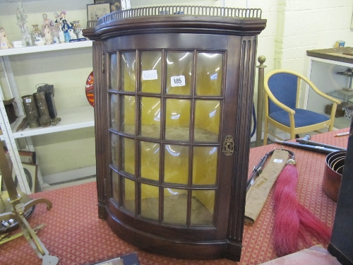 A glazed mahogany corner cabinet with glazed door containing 20 glass panels with shelved interior.