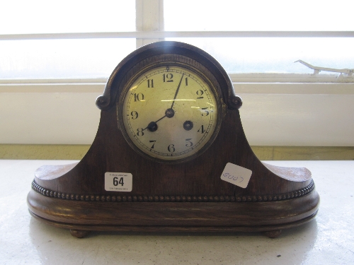 An early 20th century oak cased chiming mantle clock.