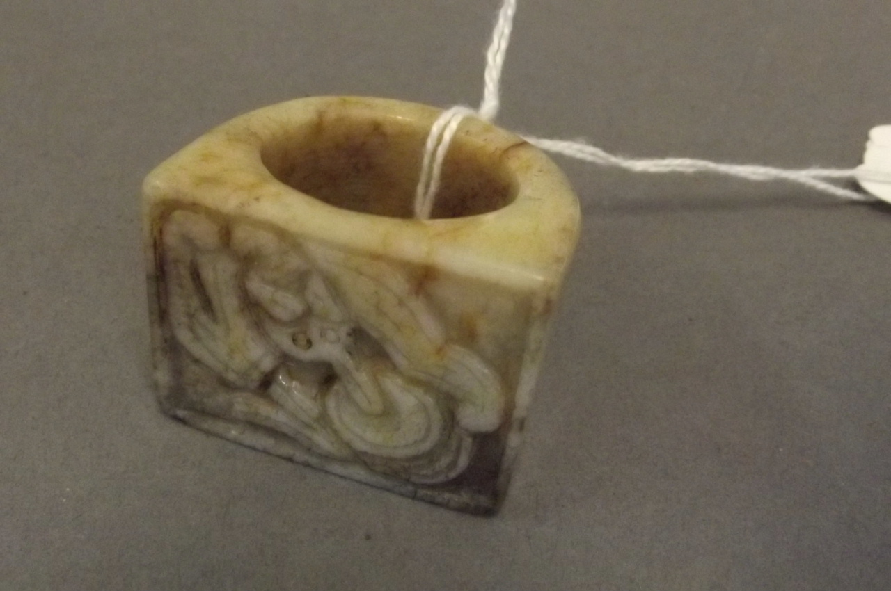 A Chinese carved jade archers ring, 1½'' diameter