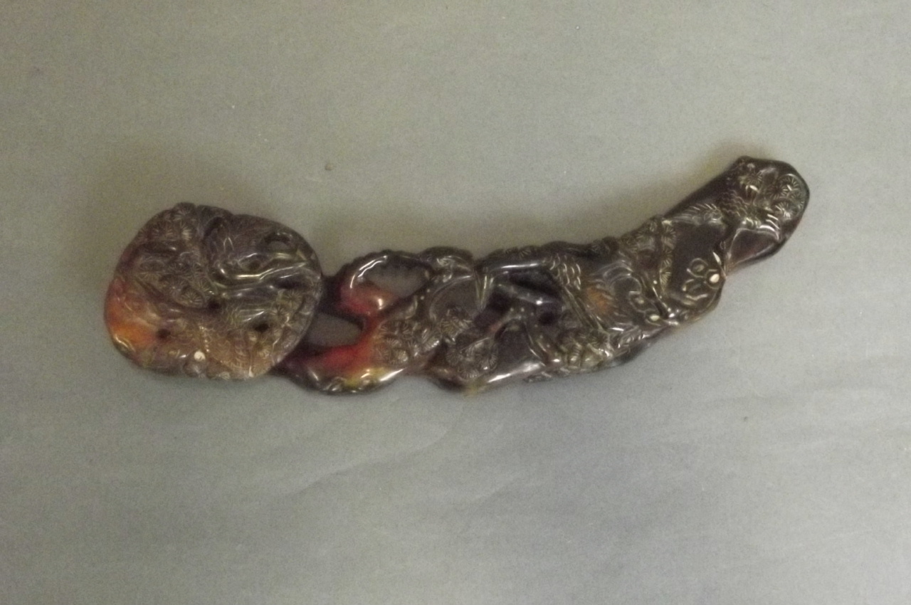 A Chinese carved and pierced horn ruyi decorated with birds etc, 9½'' long