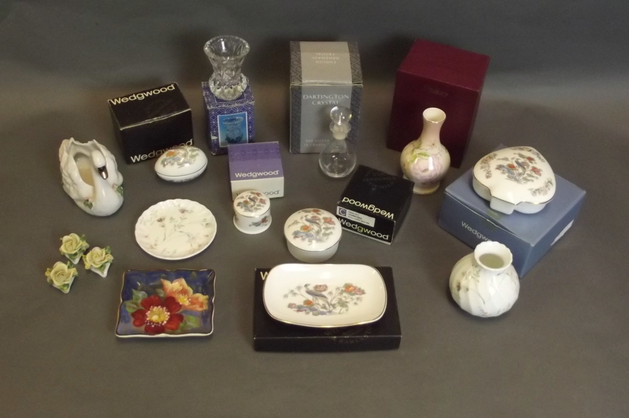 A quantity of boxed Wedgwood and Royal Worcester pots and vases, A Dresden swan, and various other