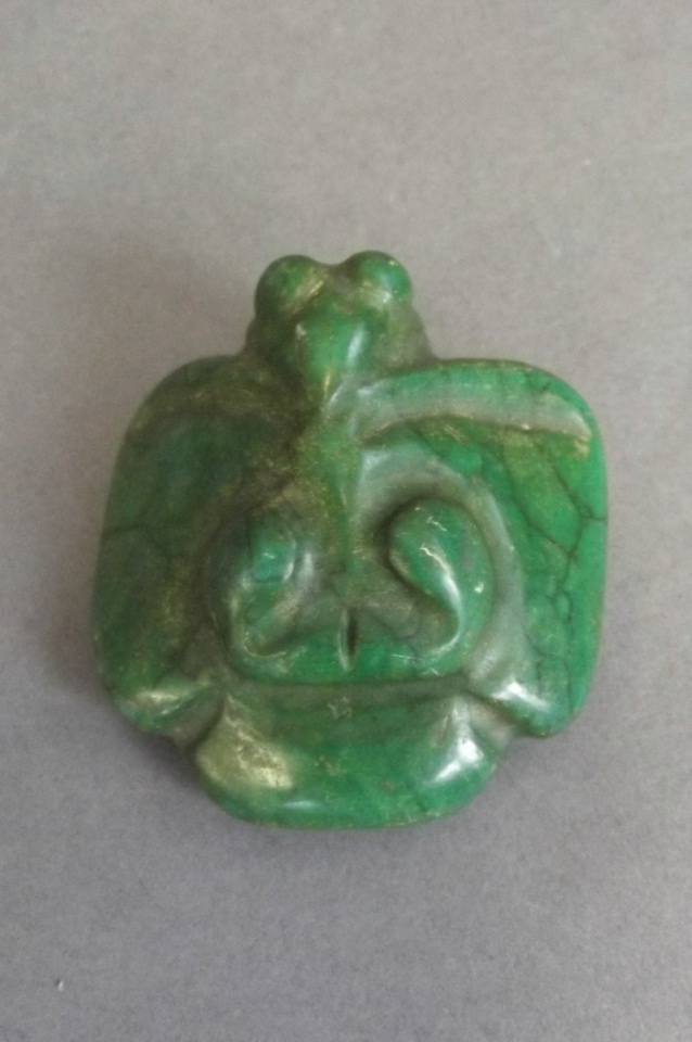 A Chinese hardstone pendant carved in the form of a bat, 2'' square