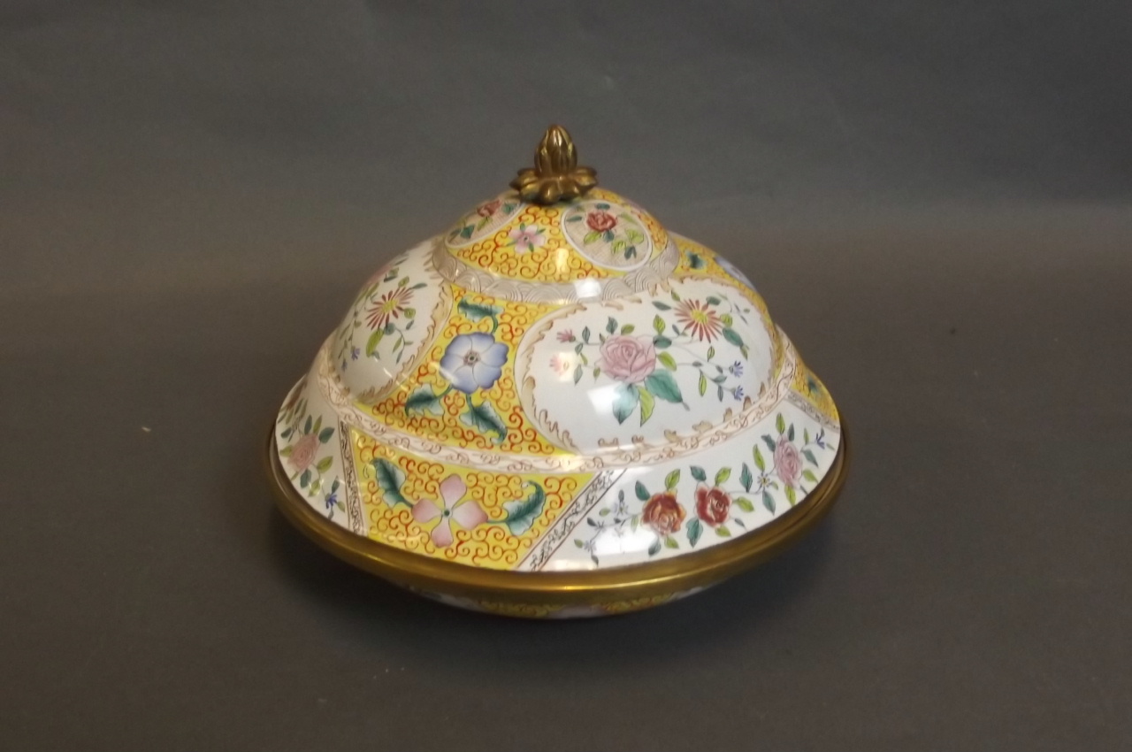 A shaped and enamelled bowl and cover with rose decoration to exterior, 6¾'' diameter