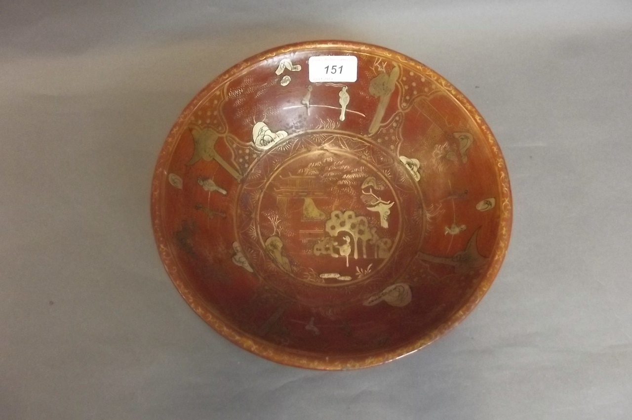 A Chinese red lacquer bowl, seal mark to base, 10'' diameter