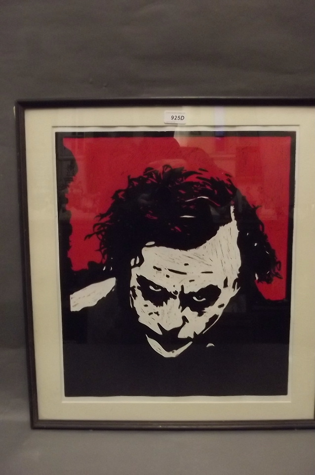 A framed screen print of Batman villain 'The Joker' portrayed by Heath Ledger, 24'' x 22''